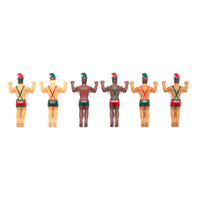 Set of six small figurines in swimsuits on a white background