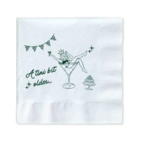 White paper cocktail napkin with a girl in a martini glass and text that reads "A Tini Bit Older" for martini themed birthday parties and celebrations is shown against a white background