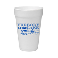 A white foam cup with blue printed text reading 'ERRBODY at the LAKE gettin' tipsy' and small wave graphics, shown on a plain white background.