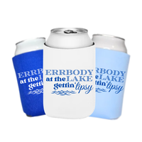Three can coolers with blue and white designs and text on a white background. The can coolers feature matching text that reads "Errbody At The Lake Gettin' Tipsy" 