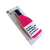 A novelty wine bottle-shaped cleaning sponge on a white cardboard backing. The sponge is bright pink with a dark blue top and black printed text that reads, 'It's your birthday, you can wine if you want to.