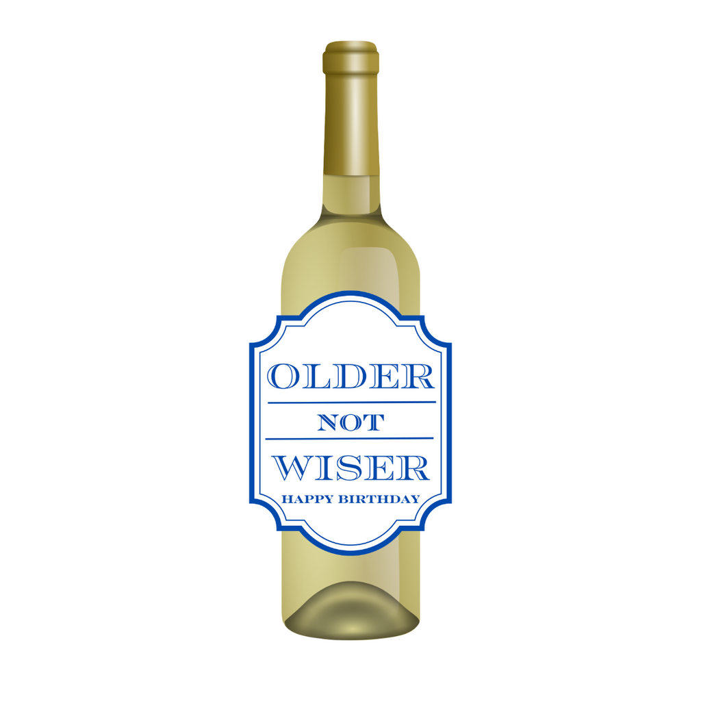 White wine bottle with a fun birthday wine label featuring blue text that reads "Older Not Wiser - Happy Birthday." Perfect for milestone birthdays, this fun gift is a cheeky way to help someone celebrate being a year older  