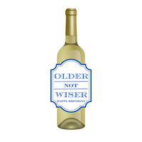 White wine bottle with a fun birthday wine label featuring blue text that reads "Older Not Wiser - Happy Birthday." Perfect for milestone birthdays, this fun gift is a cheeky way to help someone celebrate being a year older  
