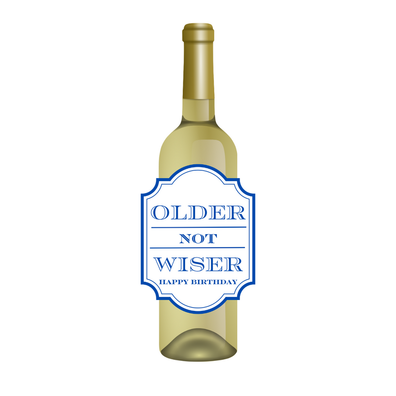 White wine bottle with a fun birthday wine label featuring blue text that reads "Older Not Wiser - Happy Birthday." Perfect for milestone birthdays, this fun gift is a cheeky way to help someone celebrate being a year older  