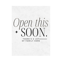 Close up of white wine label with black text 'Open this SOON. THERE'S A LOT OF FAMILY HERE' on a white background