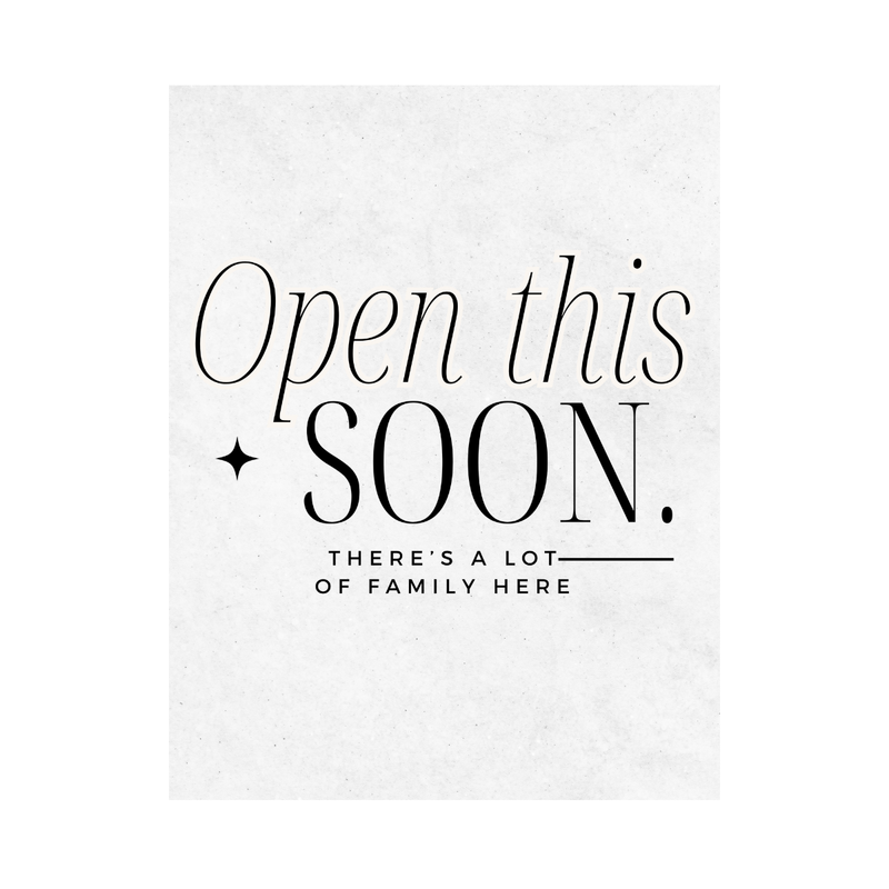Close up of white wine label with black text 'Open this SOON. THERE'S A LOT OF FAMILY HERE' on a white background