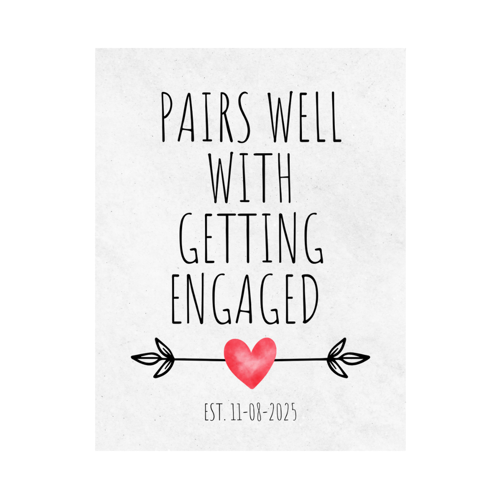 Close up of a white wine label with the text "Pairs well with getting engaged" along with the engagement date. Fun party favor or décor for an engagement party or engaged couple.  