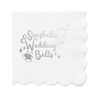 Decorative white paper cocktail napkin with 'Seashells & Wedding Bells' text and decorative elements in silver foil is shown on a white background.