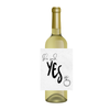 Wine bottle with a wine label reading 'She said... Yes' and an illustration of a diamond ring on a white background. Perfect for engagement parties, or as a fun gift to the newly engaged couple. 