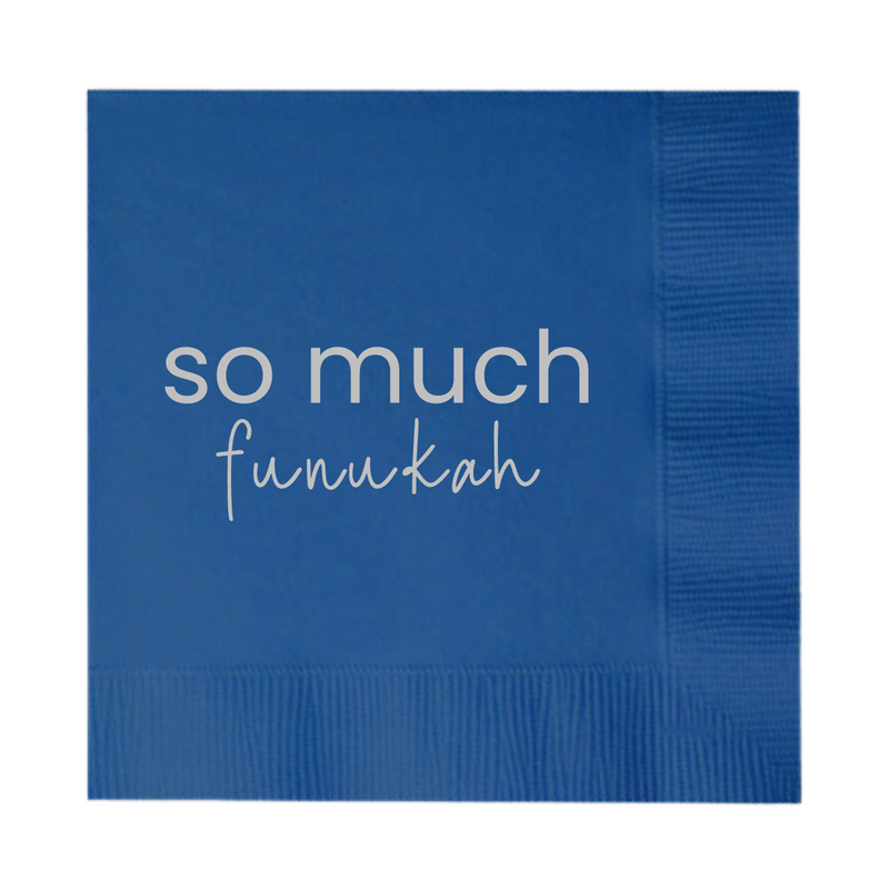 A Hanukkah Napkin that features the phrase "So MMuch funukah). Silver foil stamped design on a blue paper cocktail napkin.