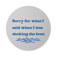 Round white pulp board 4" Sunshine Daisy coaster featuring fun text that says "Sorry for what I said when I was docking the boat" and a wave design on a white background