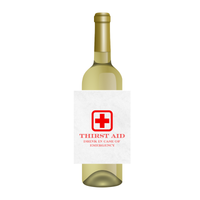Bottle of white wine with a humorous waterproof wine label featuring a red cross and the phrase "Thirst Aid - Drink In Case Of Emergency." A perfect gag gift for doctors or nurses, or for anyone in need of a little thirst aid!