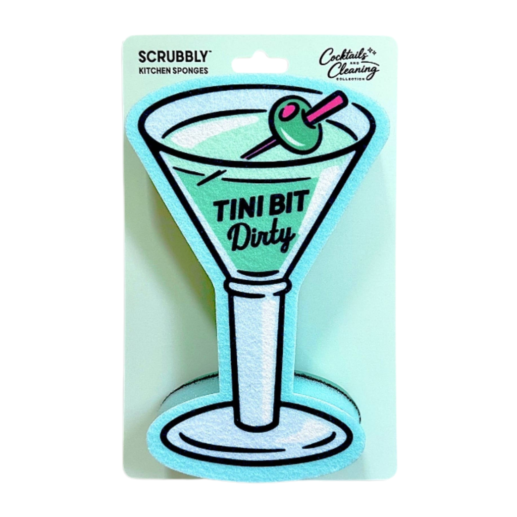 A cocktail-themed kitchen sponge shaped like a martini glass, attached to a light blue backing card. The card reads 'SCRUBBLY KITCHEN SPONGES' and 'Cocktails & Cleaning' with the sponge itself reading 'TINI BIT Dirty'.