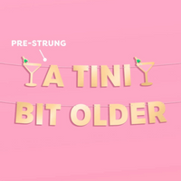 Tini Bit Older Banner - gold foil banner