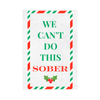 Close-up of a funny holiday wine label that features the text "We Can't  Do This Sober" in a candy-striped  frame. 